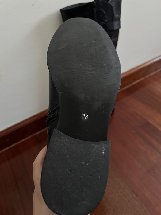 Botas cano alto de pele