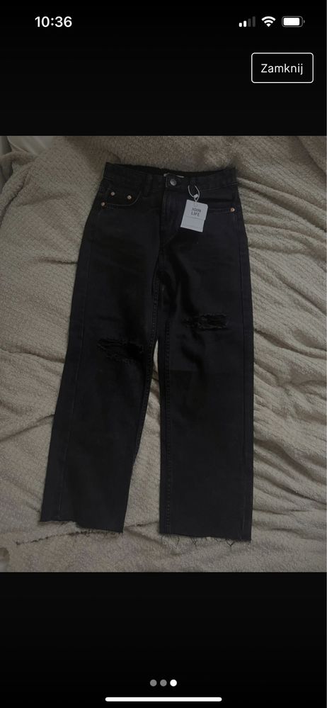 czarne jeansy o prostym kroju z dziurami
