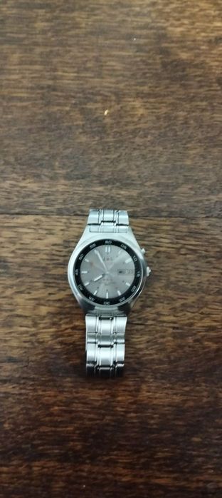 Orient автоматичний годинник 

Цін