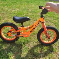 Rowerek Kellys biegówka pomarańczowy do nauki jazdy na rowerze