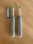 2 szczoteczki elektryczne Braun. 2x etui, 2x ladowarka, 3x koncowki