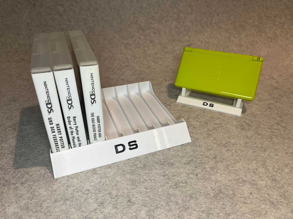 Zestaw stojakow na 8 gier oraz konsole Nintendo DS