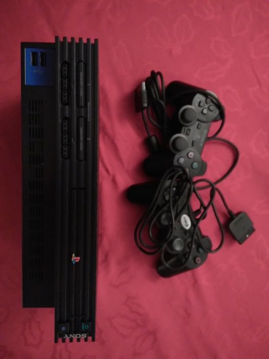 PS2 2 + jogos + comandos Buzz + camara eye toy