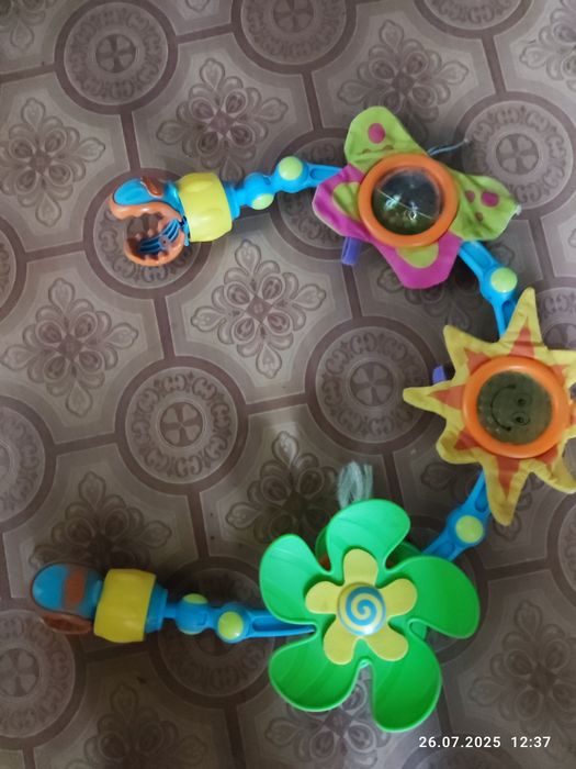 Дитяча іграшка на коляску