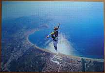 Puzzle Carrefour 1500 - Skok spadochronowy nad Costa Brava