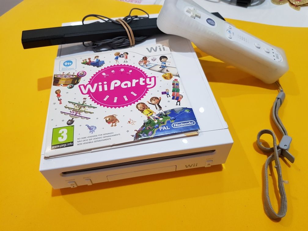 Consola wii com um jogo e um comando