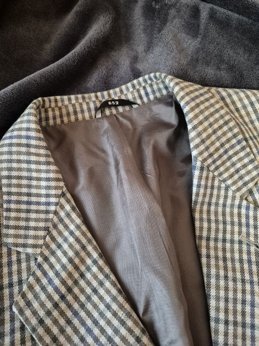 Чоловічий піджак у клітинку