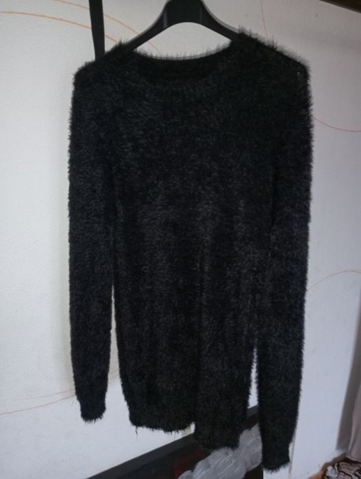 Malhas, casacos e camisolas