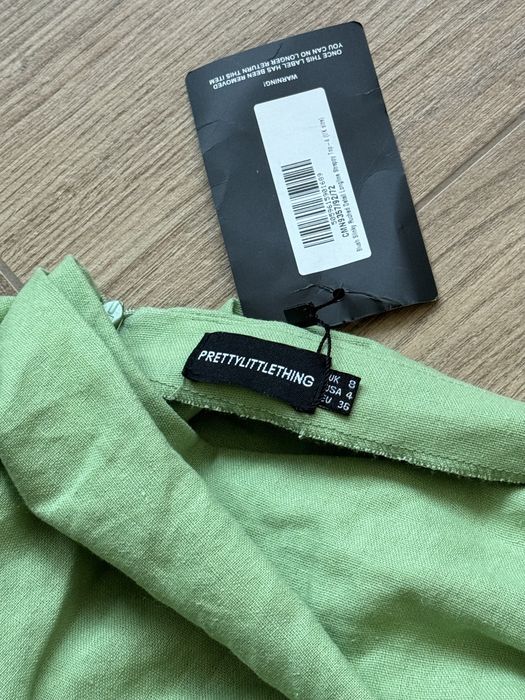 Зелена лляна нова юбка з драпіровкою