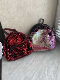 Детский рюкзак в паетках: красного и розово-чёрного цвета