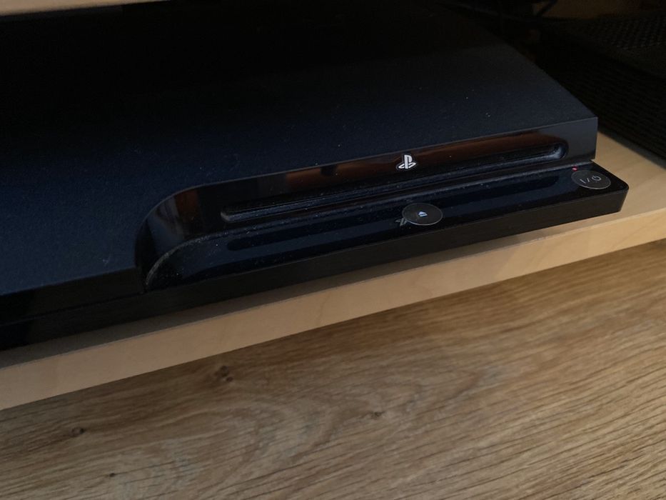 Playstation3 slim  + comando + cabos + jogo + eye pet + peça singstar