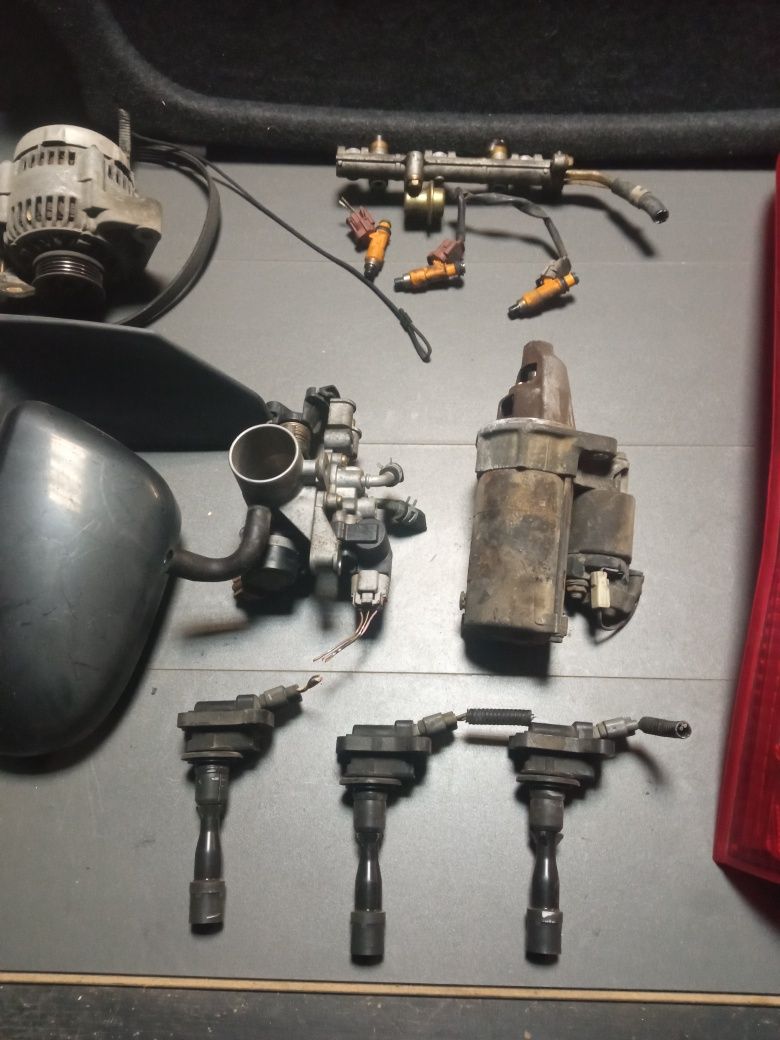 Daihatsu cuore II alternator rozrusznik lampy lusterka cewki wtryski