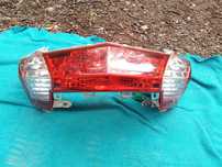 Farol traseiro(Stop) Kymco Downtown 125i.  2016