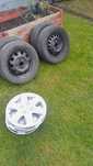 Koła 4x100 14" plus kołpaki Suzuki opony całoroczne