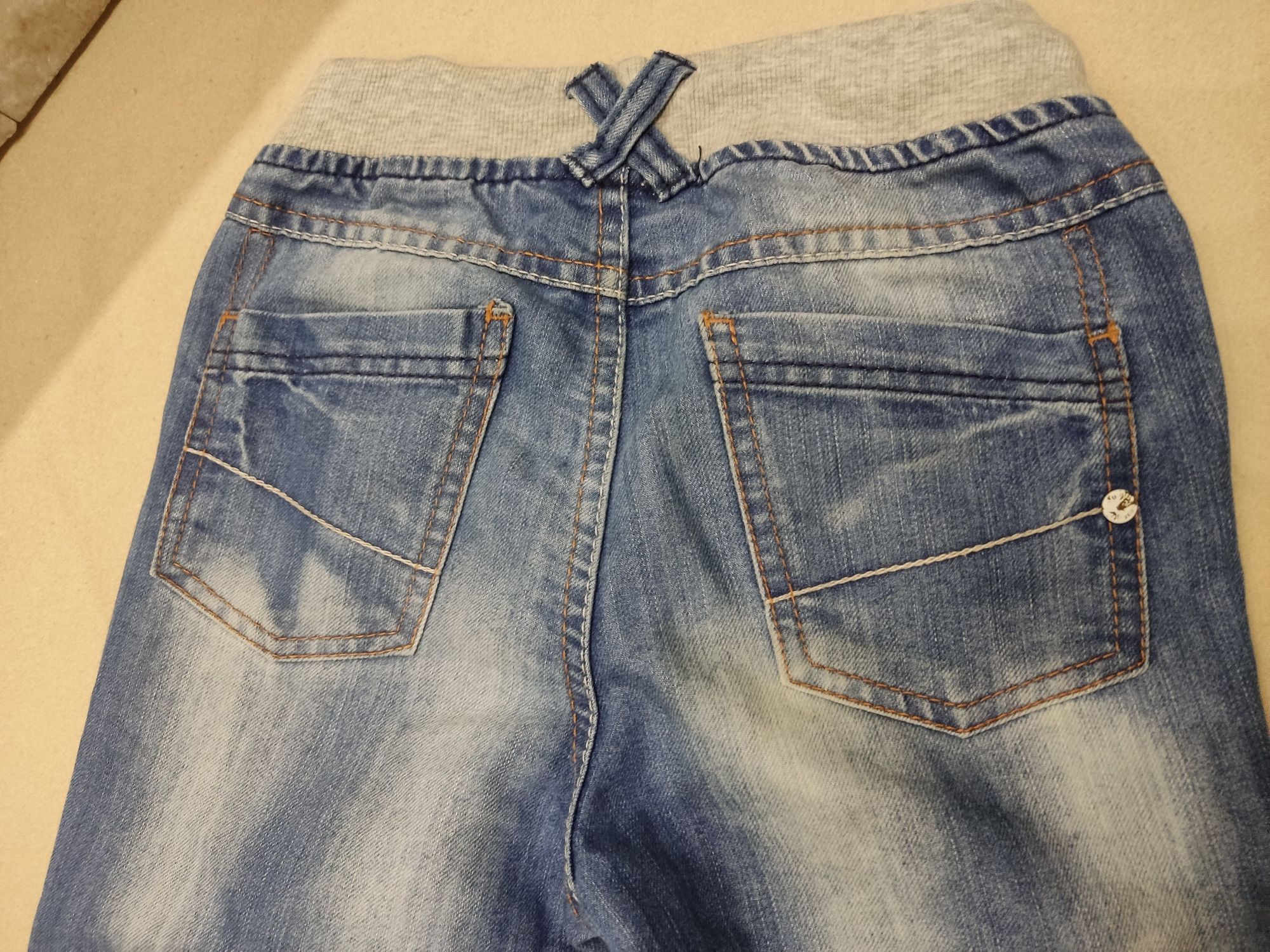 CoolClub modne spodnie jeansowe Smyk w rozmiarze 116