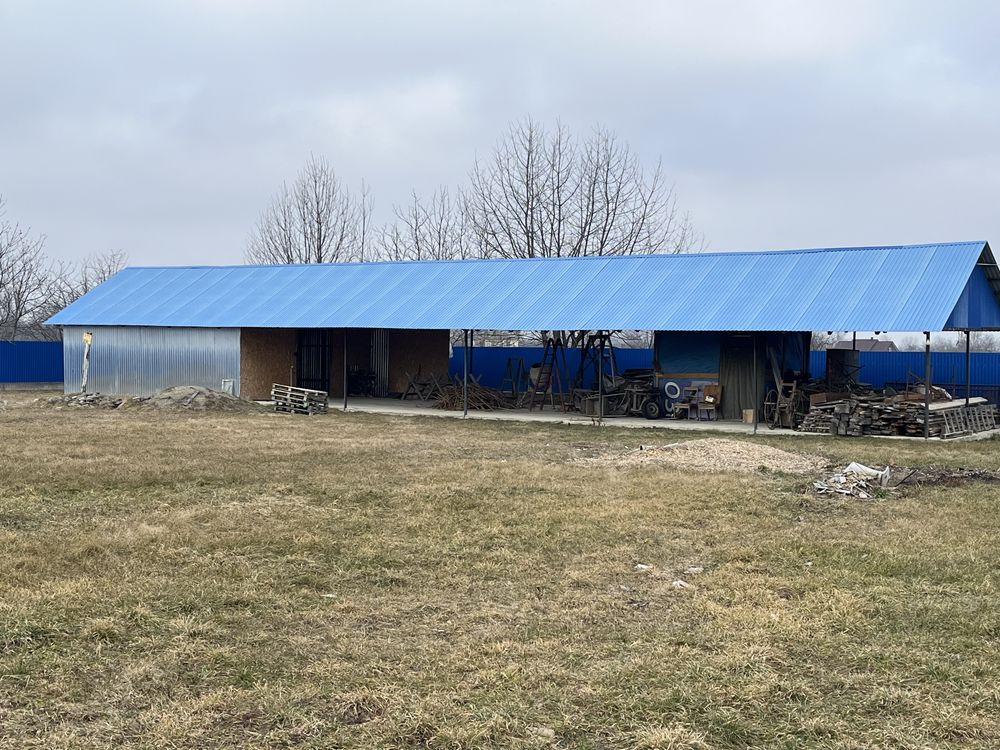 Продам 1га землі з складами і хатою