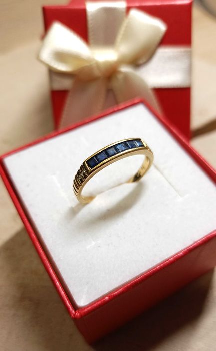 Złoty pierścionek p.750/2,35g  granatowy szafir