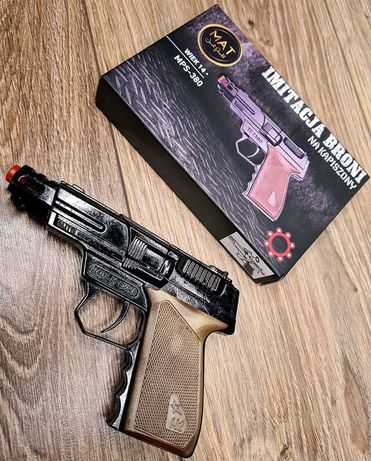 Nowy pistolet na kapiszony metalowy + komplet kapiszonów - zabawki