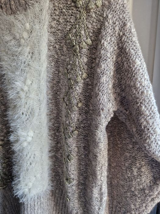 Elegancki i ponadczasowy sweter wykonany z luksusowej wełny