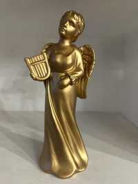 Estatueta dourada anjo