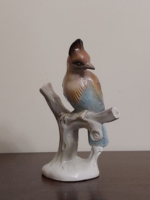 Estatueta decorativa pássaro num ramo