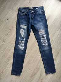 Nowe damskie spodnie jeansowe S/36