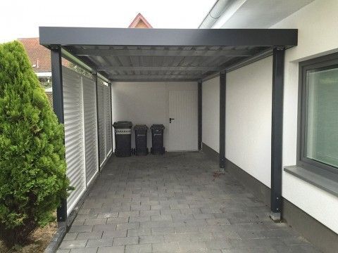 Carport wiata garażowa. Nowoczesny styl połączenia stali i drewna.