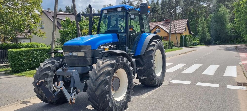 New Holland TM 150  NEW HOLLAND TM 150 Range Commande Supersteer