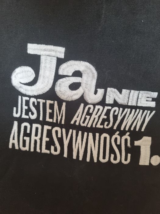 Czarna bawełniana torba z haftowanym napisem