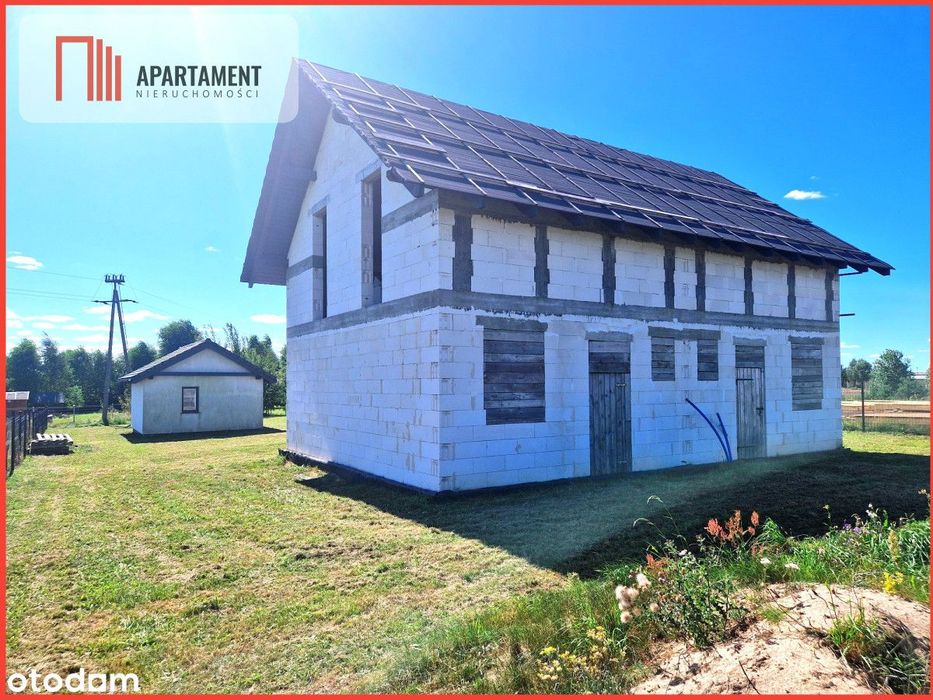 Budynek mieszkalny z domkami rekreacyjnymi.