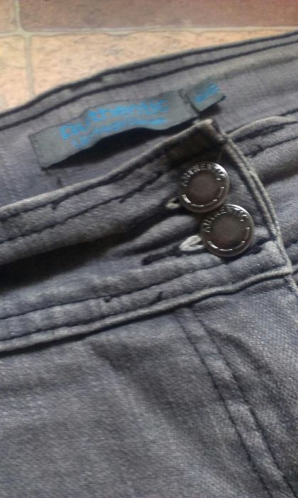 Spodnie jeans koloru szarego ,nogawki szersze u dołu 42,XL