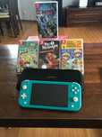 Sprzedam nintendo switch lite z 4 grami i pudełko na konsole i gry