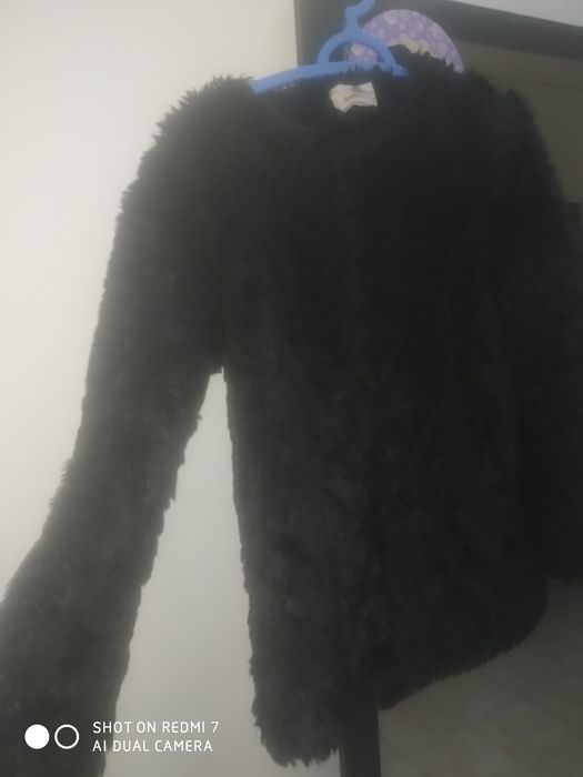 Casaco de pêlo preto