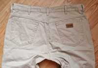 Beżowe spodnie męskie jeans Wrangler Texas W38L34