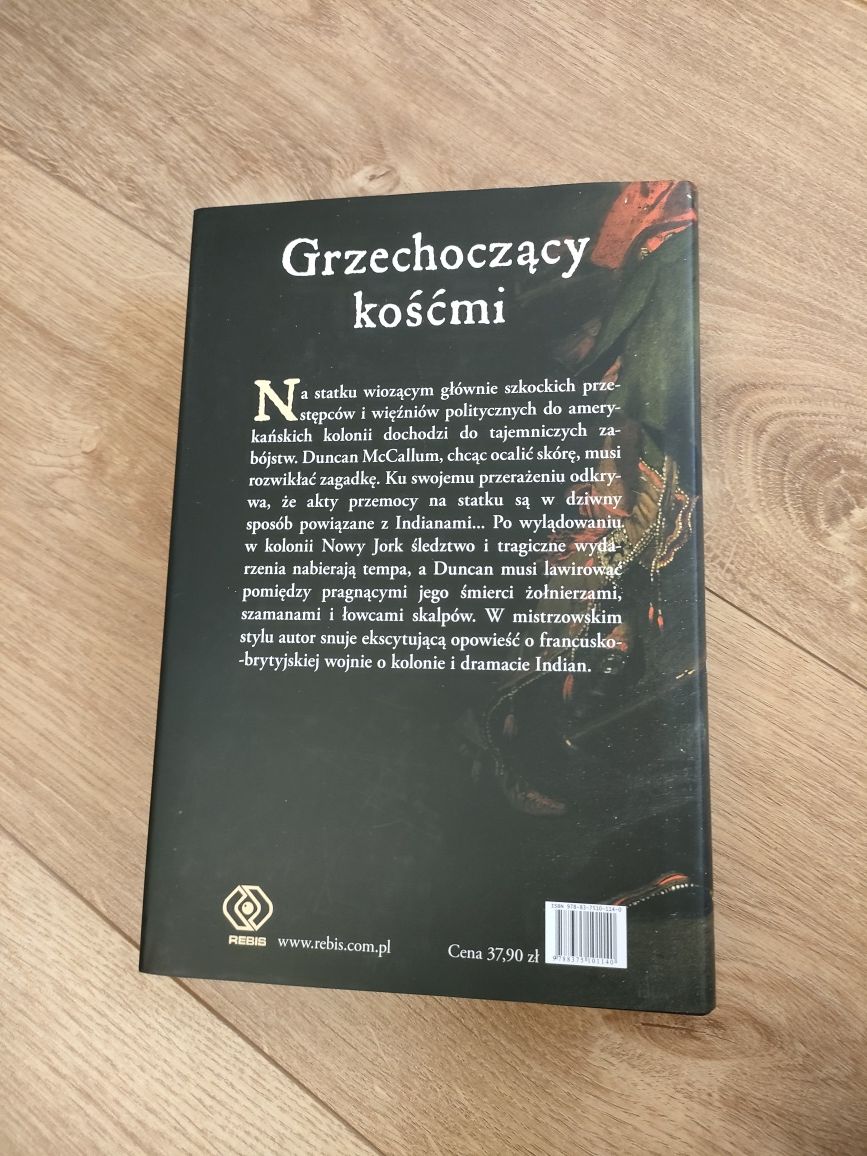 Grzechoczący kośćmi Eliot Pattison książka