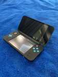 Konsola Nintendo 2DS XL z dwoma grami i pokrowcem