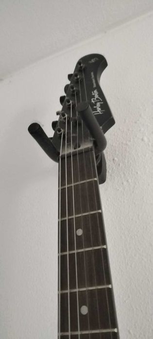 Apoio de parede para guitarra
