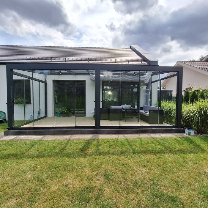 Ogród zimowy szyby przesuwne balkon taras
