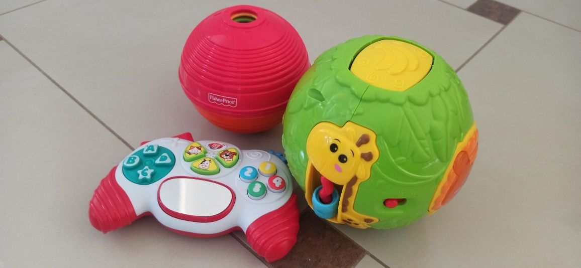 3 zabawki, pad interaktywny, piłka układanka i piłka grająca