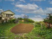 Terreno em zona residencial com frente para a estrada principal