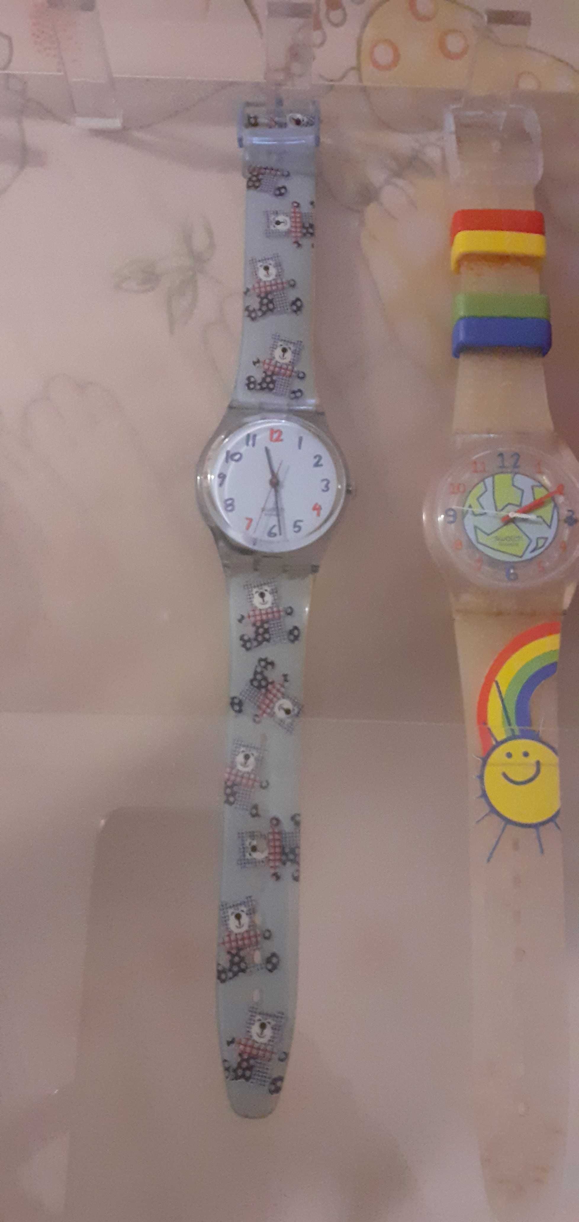 Relogios swatch em caixa da marca de exposicao