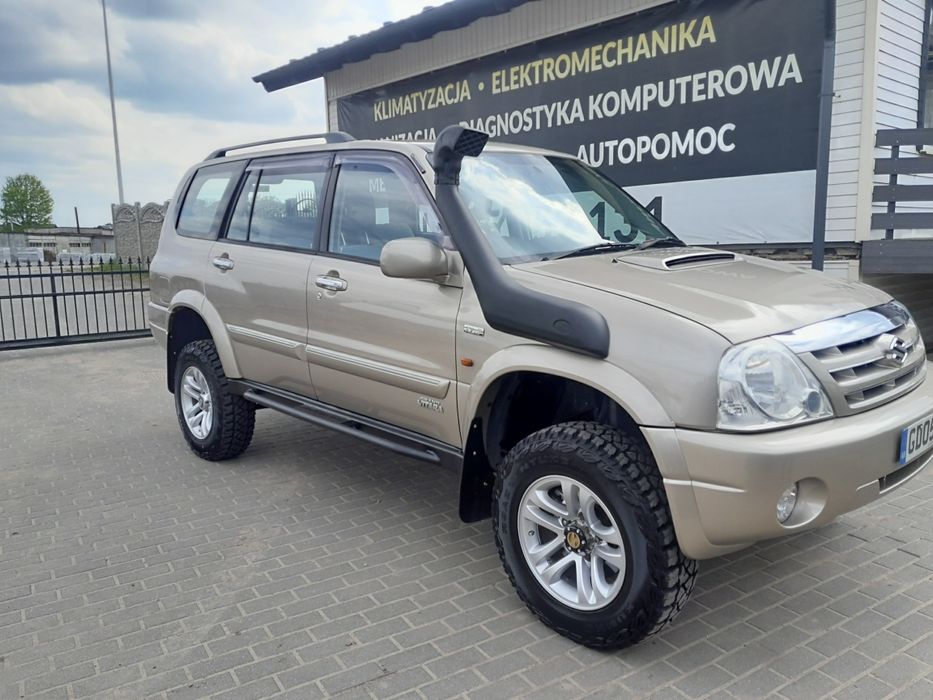 Suzuki grand vitara xl7 progi stalowe z orurowaniem bocznym