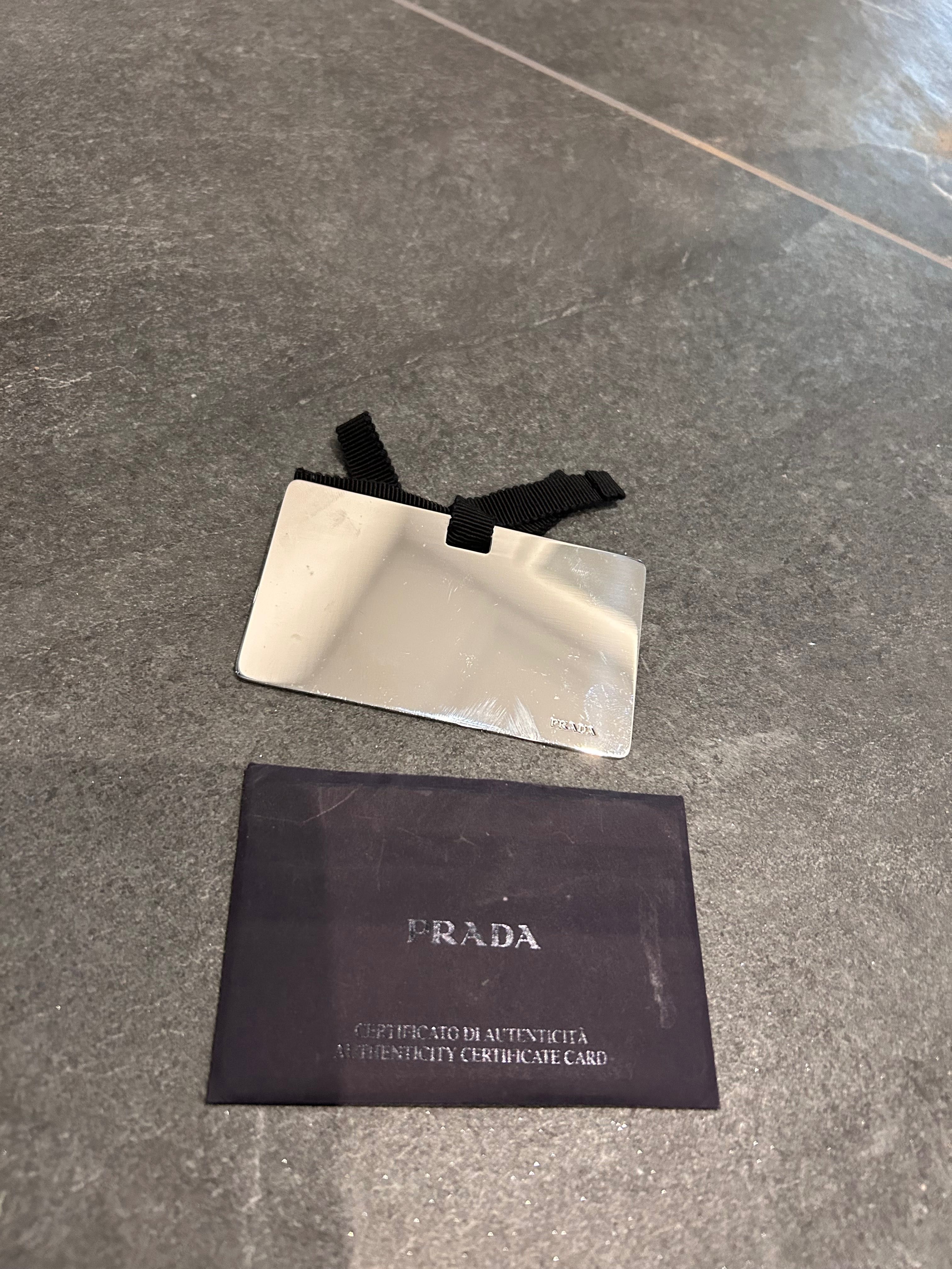 Oryginalna torebka Prada srebrna