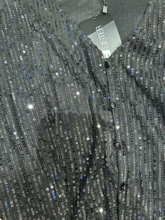 Чорна кофтинка в паєтки