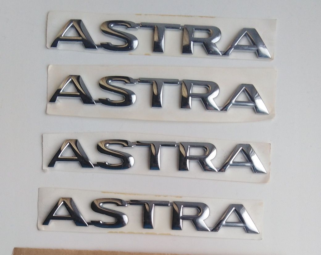 Эмблемы, надписи на Opel Astra.