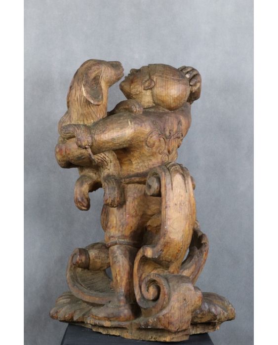 Młodzieniec z psem. Drewno. Rzeźba egzotyczna. XIX wiek.