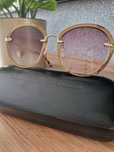Alexander McQueen okulary przeciwsłoneczne.  Brąz złoto