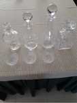 Vendo 4 garrafas de cristal e 3 copos para conhaque, também em cristal