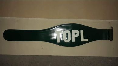 Zielona opaska na ramię z napisem TOPL - NAJTANIEJ!