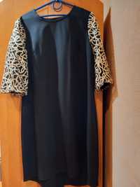 Платье черного цвета,  нарядное, с красивым оригинальным рукавом